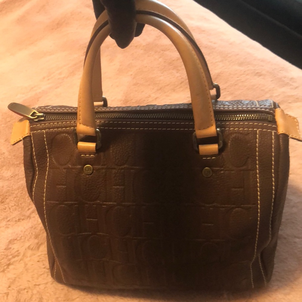 Authentic Carolina Herrera bag chocolate brown w/tan handles.Excellent condition